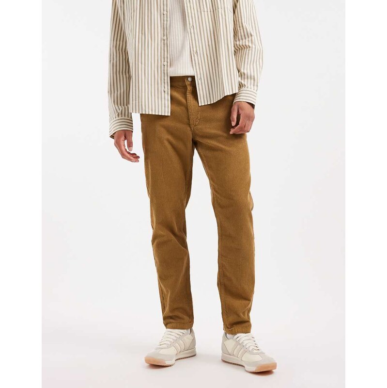 ASOS DESIGN tapered trousers in brown corduroy