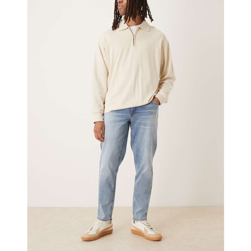 ASOS DESIGN stretch tapered fit jeans in mid wash blue