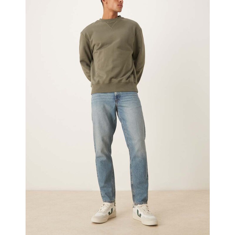 ASOS DESIGN tapered jeans in mid wash blue