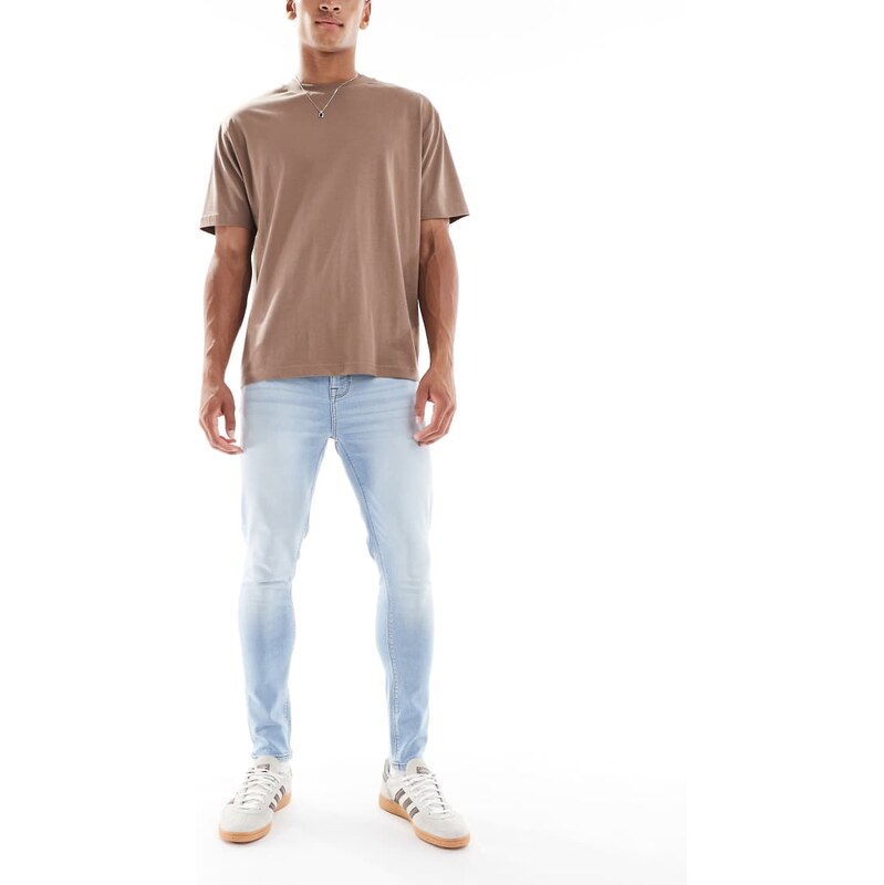 ASOS DESIGN power stretch jeans in light wash blue