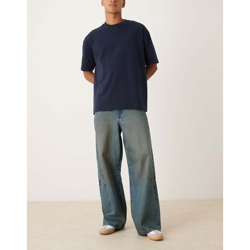 ASOS DESIGN loose jeans in mid wash blue with brown tint