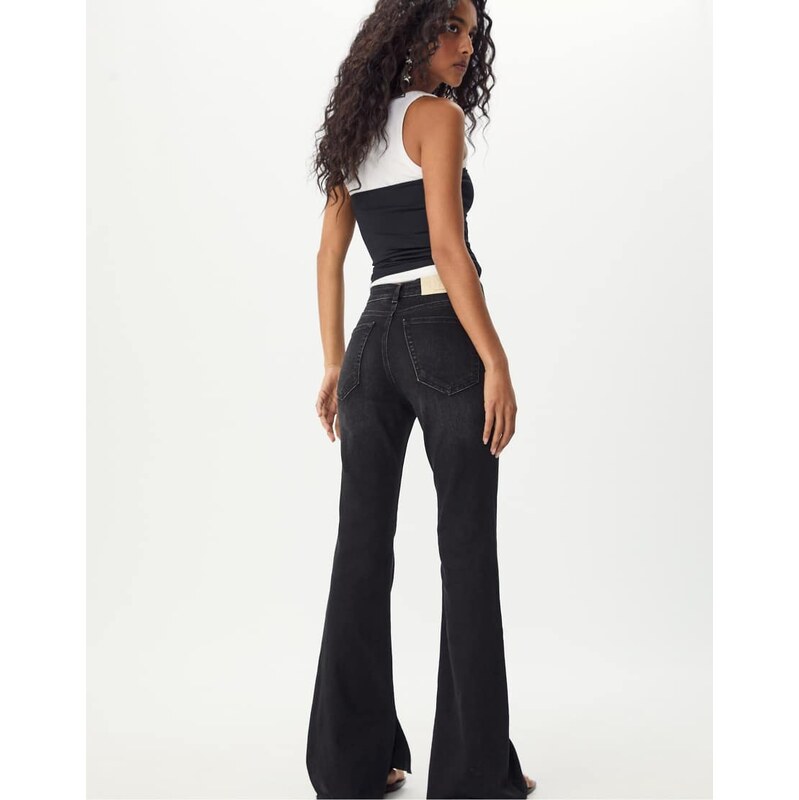 Stradivarius Slit fit flared jeans in black denim rinse wash