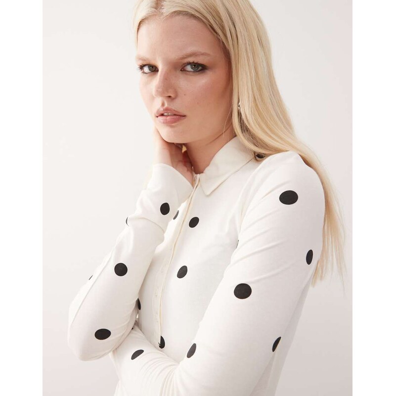 Monki long sleeve jersey shirt bodysuit in white and black polka dot 108543489
