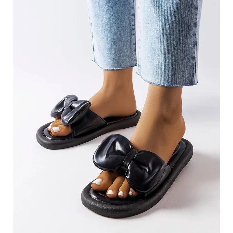 marka niezdefiniowana Black flip-flops with a bow Lende 108669321