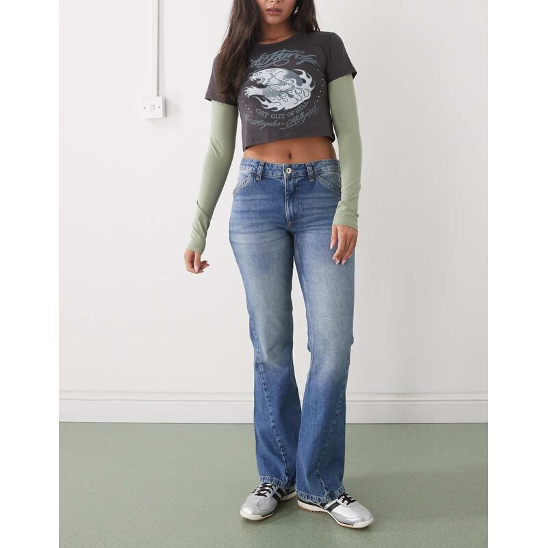 COLLUSION low rise flare jean with twisted seams in washed blue 111155742