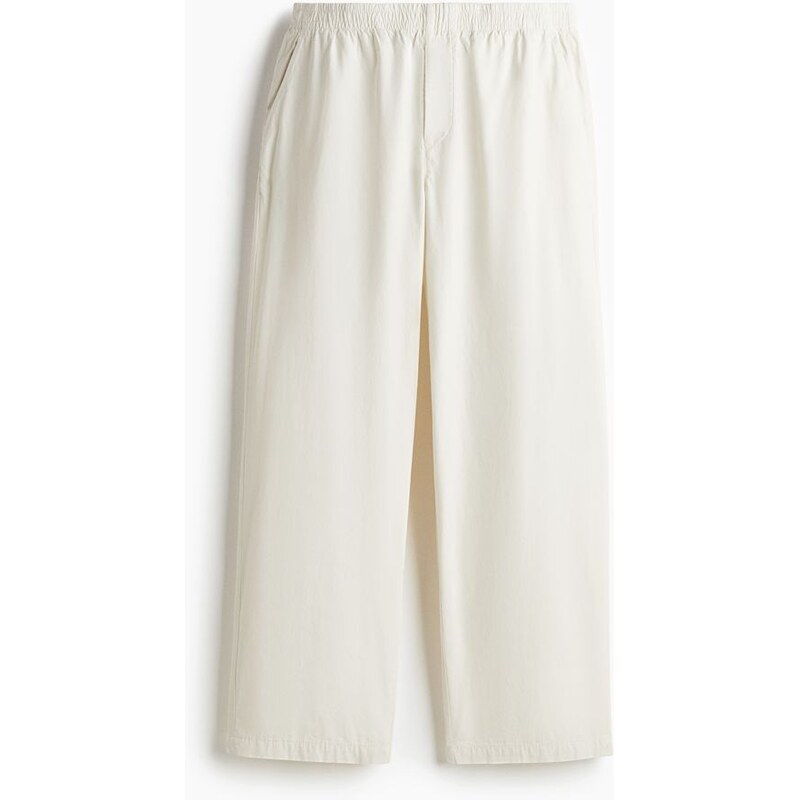H&M - Bavlněné kalhoty Relaxed Fit - Krémová