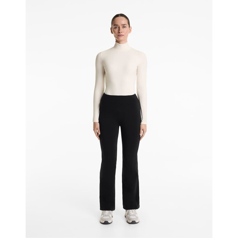 OYSHO Bootcut seamless high rise super extra warm trousers in black 109309538
