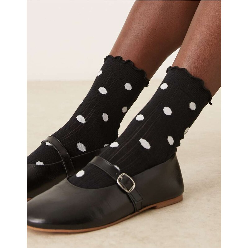 ASOS DESIGN polka dot socks with frill trim in black and white