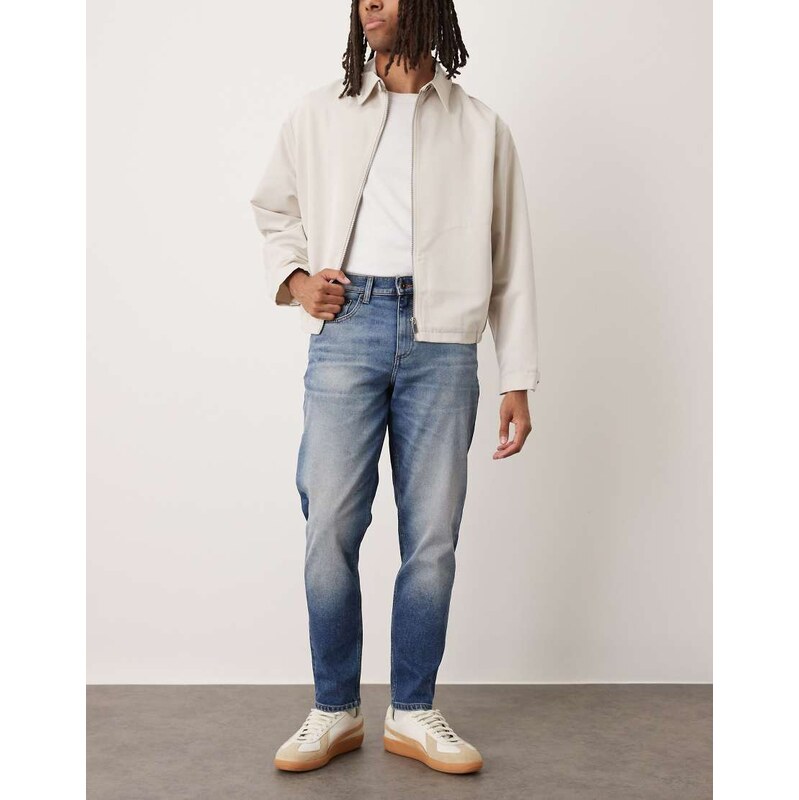 ASOS DESIGN stretch tapered jeans in dark wash blue