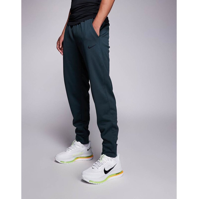 Nike Training Therma tapered trousers in green