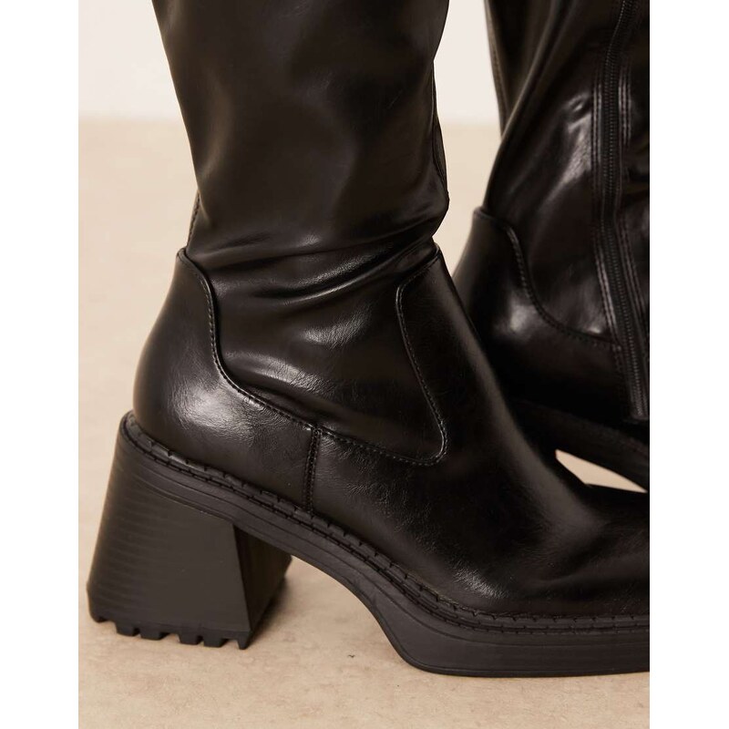 ASOS DESIGN Curve Charly heeled knee boots in black