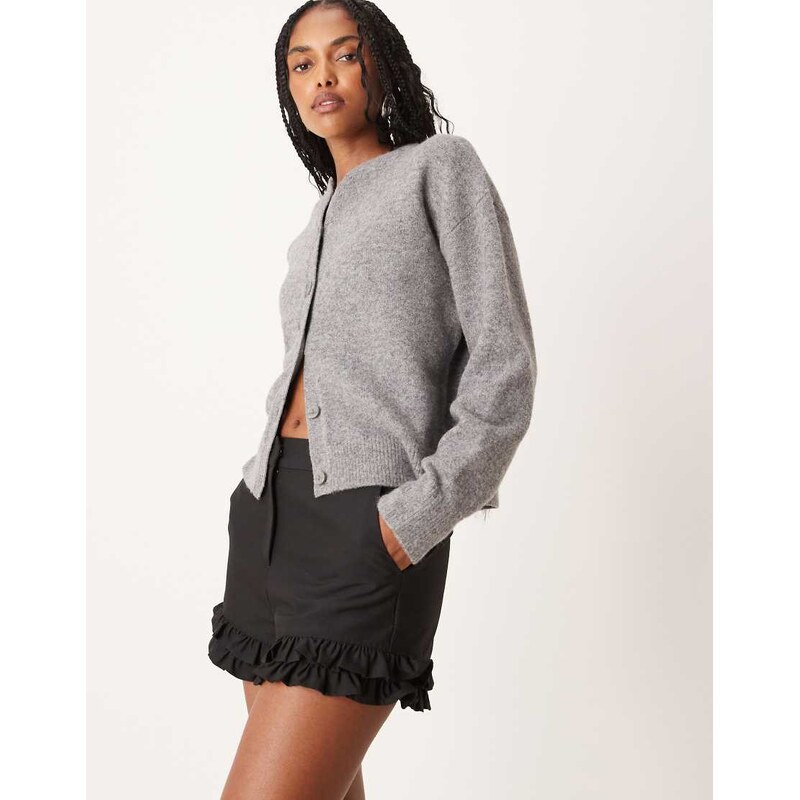 ASOS DESIGN tailored ruffle hem shorts in black