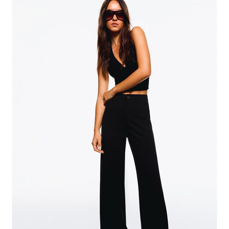 Bershka Petite wide-leg trousers in black