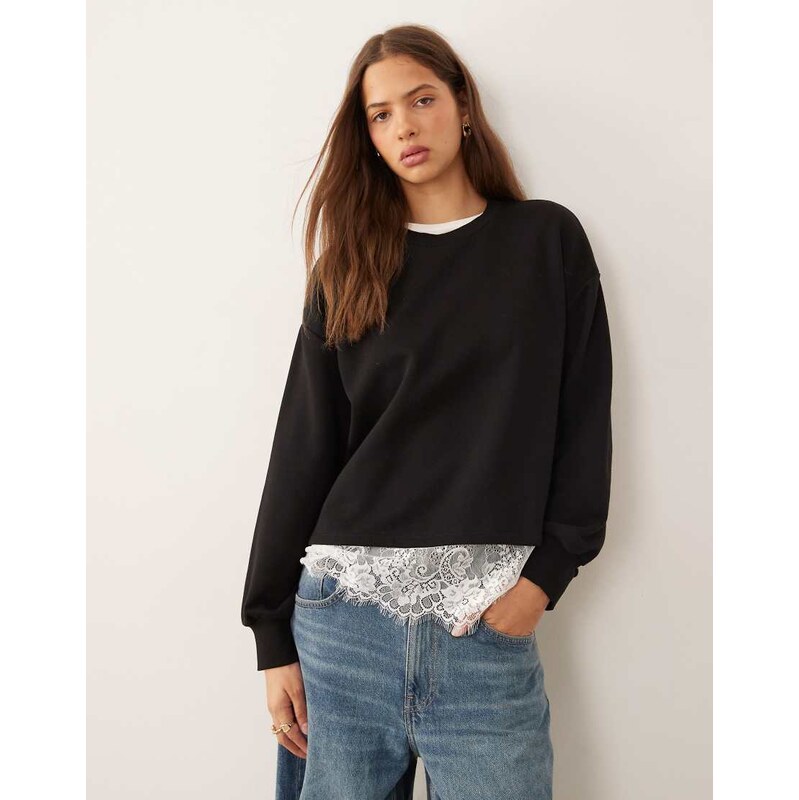 ASOS DESIGN oversized sweatshirt with lace hem underlayer detail