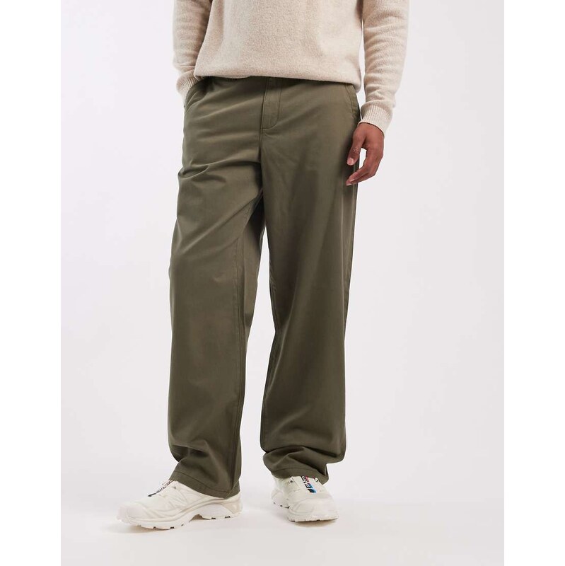 ASOS DESIGN baggy trousers in khaki with angled pockets-Green
