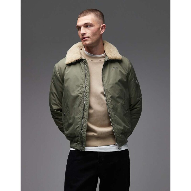 Schott logo patch zip pocket detail cropped padded jacket with