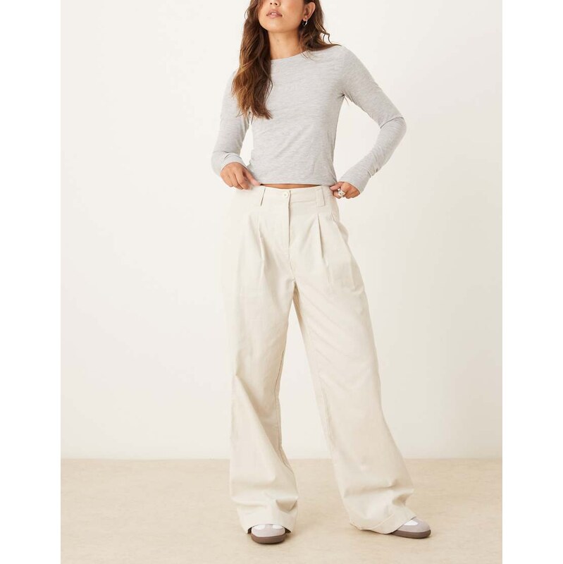 ASOS DESIGN turn up hem wide leg cord trousers in cream-White