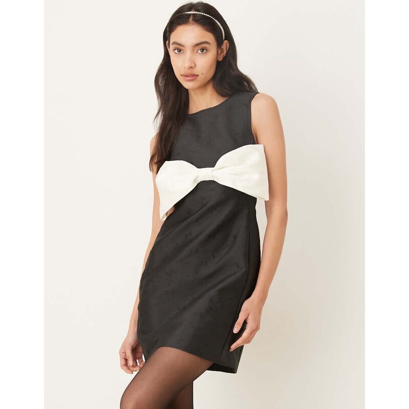Sister Jane sleeveless bow front mini shift dress in black and