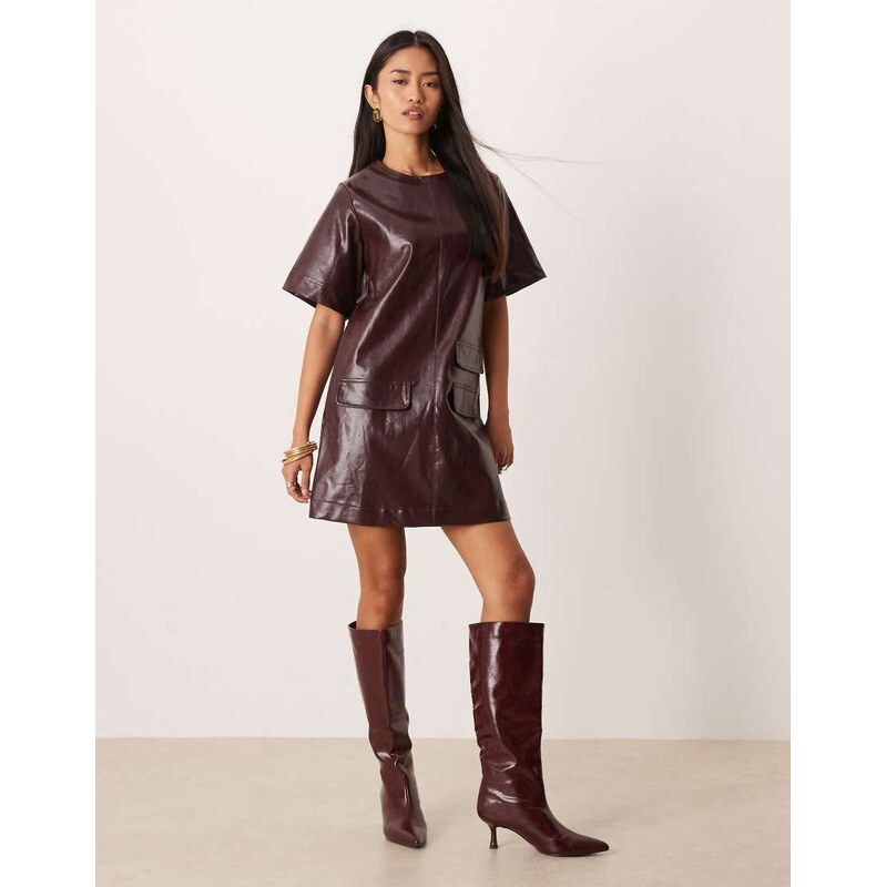 Ghospell cotton blend leather look pocket detail mini dress in 110584739