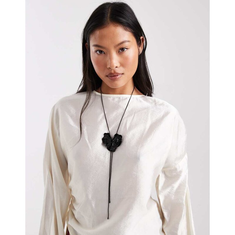 ASOS DESIGN lariat necklace with black chain and black flower detail 110609271