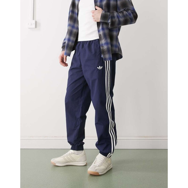 adidas Originals Firebird woven track pants in blue
