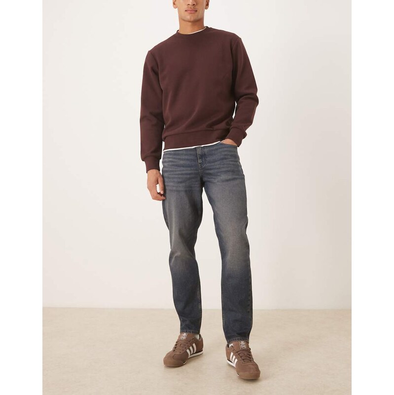 ASOS DESIGN tapered jeans in dark wash blue with tint