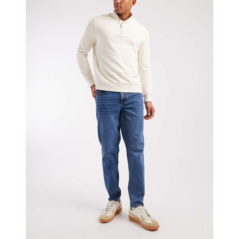 ASOS DESIGN stretch tapered jeans in mid wash blue