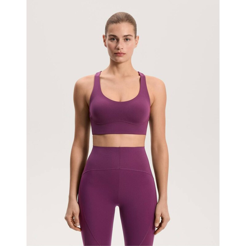 OYSHO Medium-support compressive bra with cups in dark plum