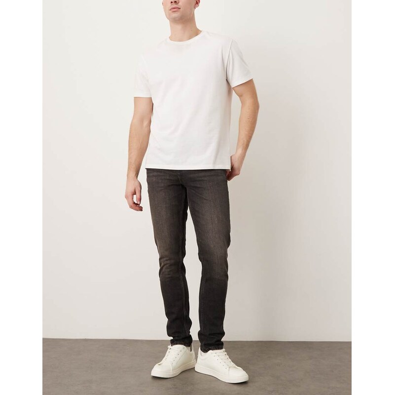 ASOS DESIGN skinny fit jeans in washed black with brown tint