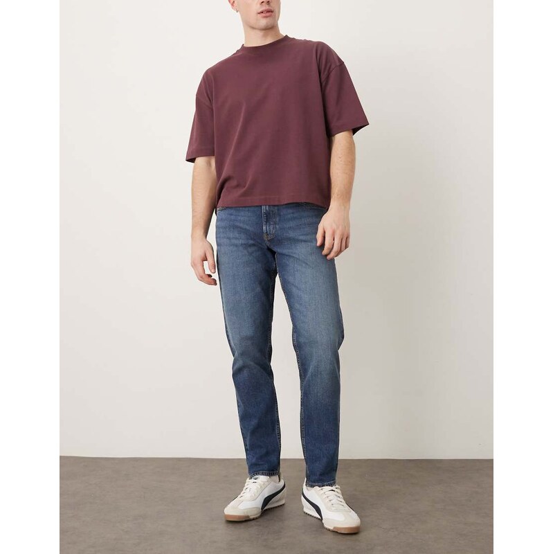ASOS DESIGN tapered jeans in dark wash blue