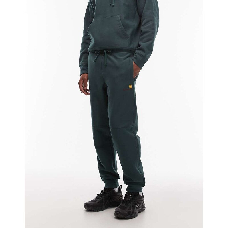 Carhartt WIP amercian script cuffed joggers in dark green