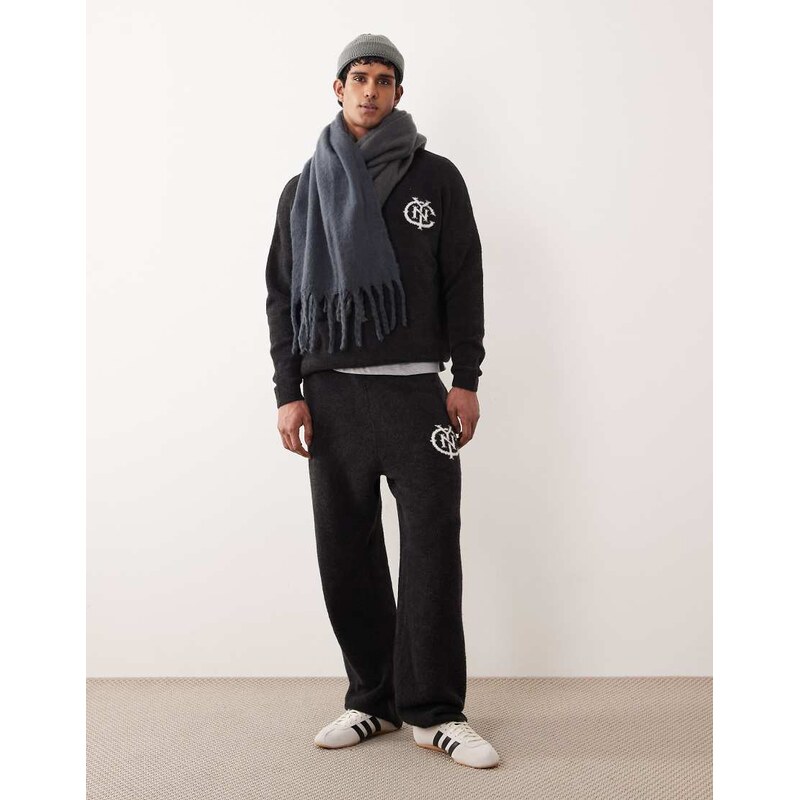 ASOS DESIGN oversized co-ord knitted cuffed joggers with NYC logo in washed black