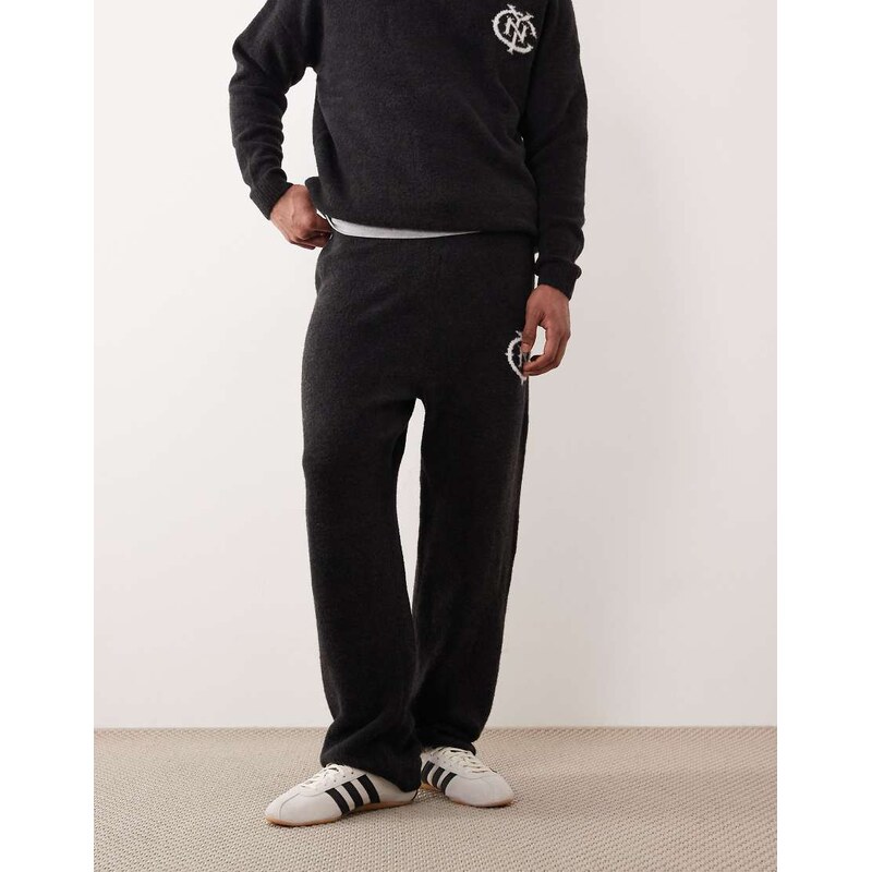 ASOS DESIGN oversized co-ord knitted cuffed joggers with NYC logo in washed black