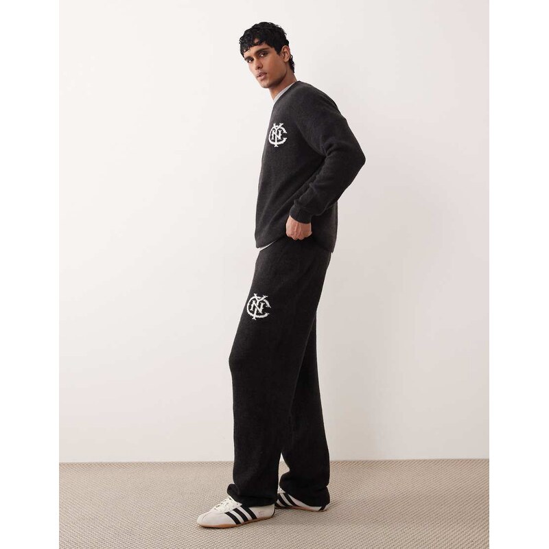 ASOS DESIGN oversized co-ord knitted cuffed joggers with NYC logo in washed black