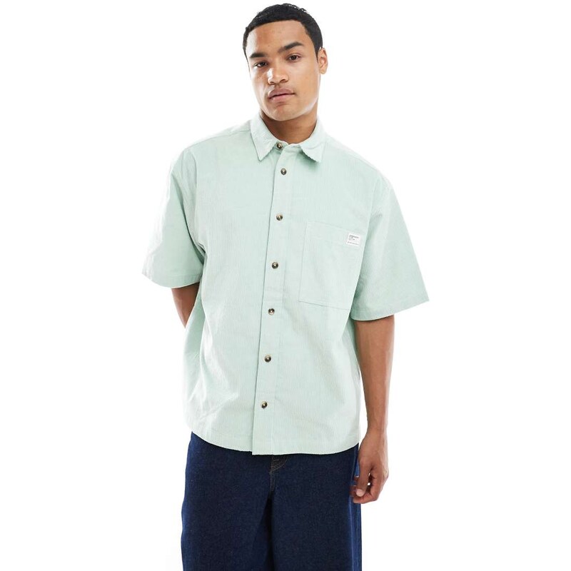 ASOS DESIGN oversized cord shirt with badge detail in green