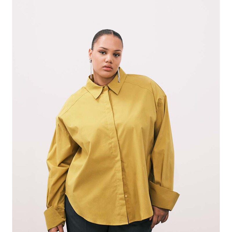 ASOS Curve ASOS DESIGN Curve shoulder pad dipped hem shirt in mustard 115516420