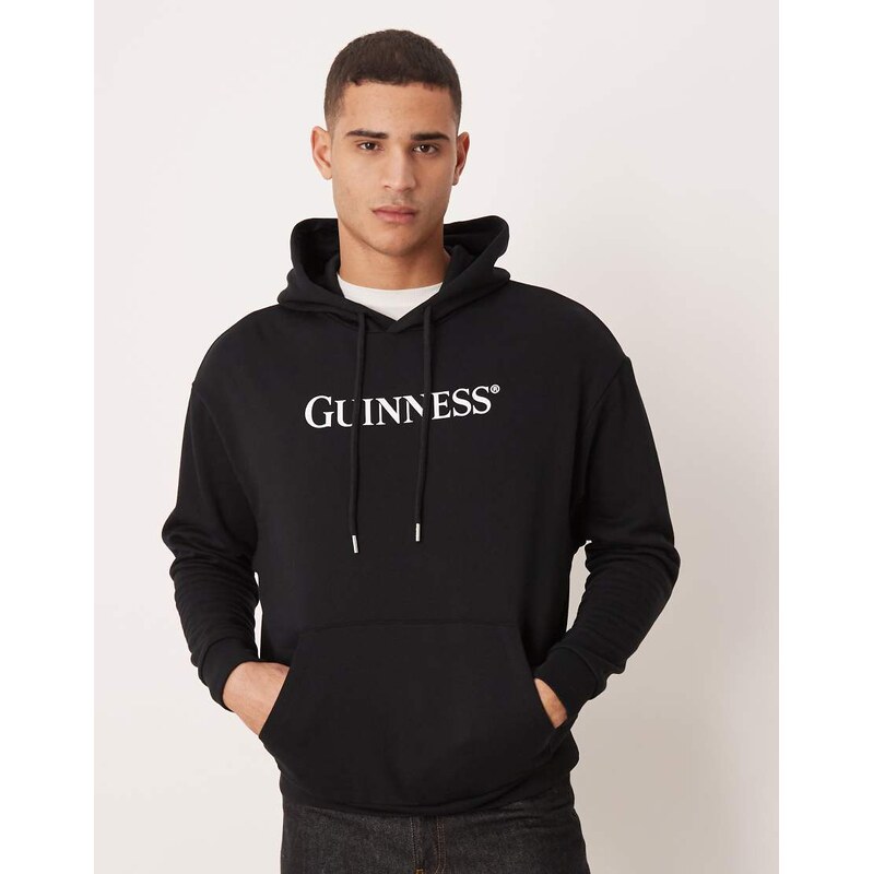 ASOS DESIGN relaxed hoodie with Guinness print in black