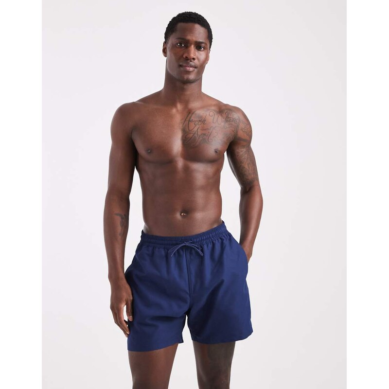 ASOS DESIGN swim shorts in mid length in navy
