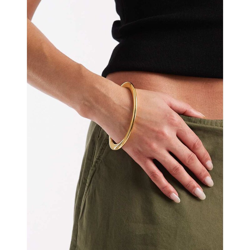 ASOS DESIGN waterproof stainless steel bangle in oval shape in gold 112191769