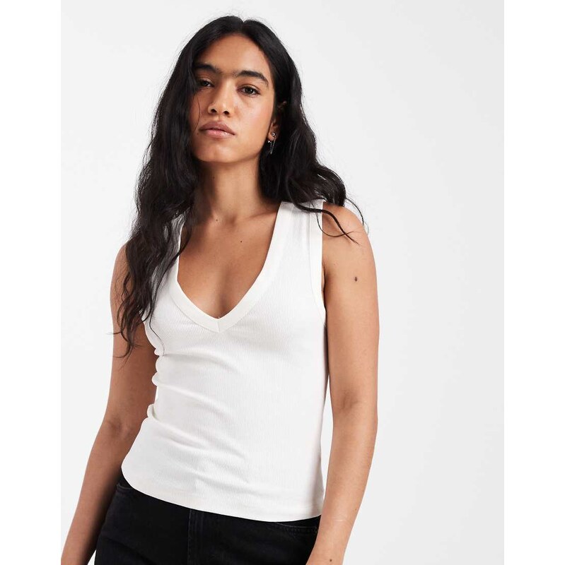 ASOS DESIGN ribbed v neck vest in ivory-White