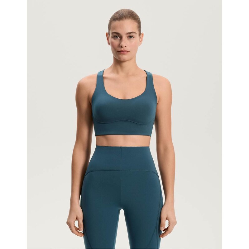 OYSHO Medium-support compressive bra with cups in dark ocean