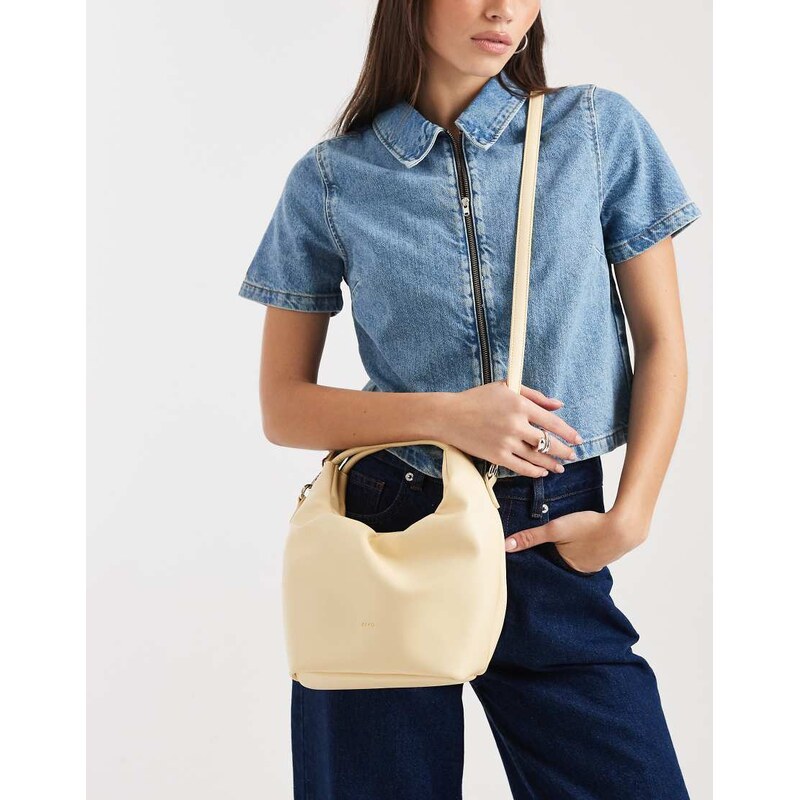 PASQ small top handle and crossbody draw string bag in butter yellow 112508586