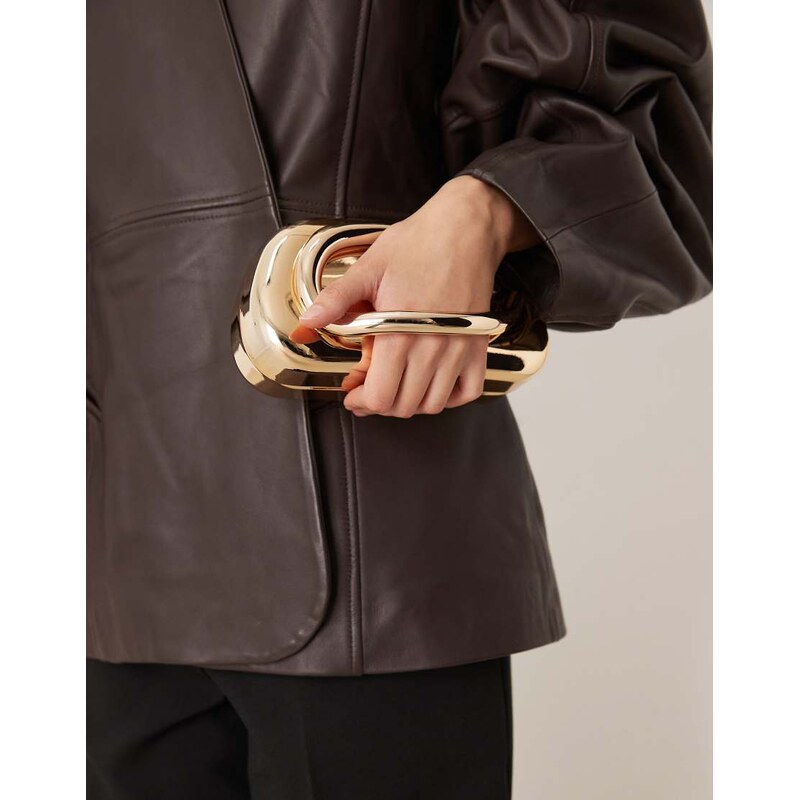 True Decadence hard clutch bag with handle detail in gold