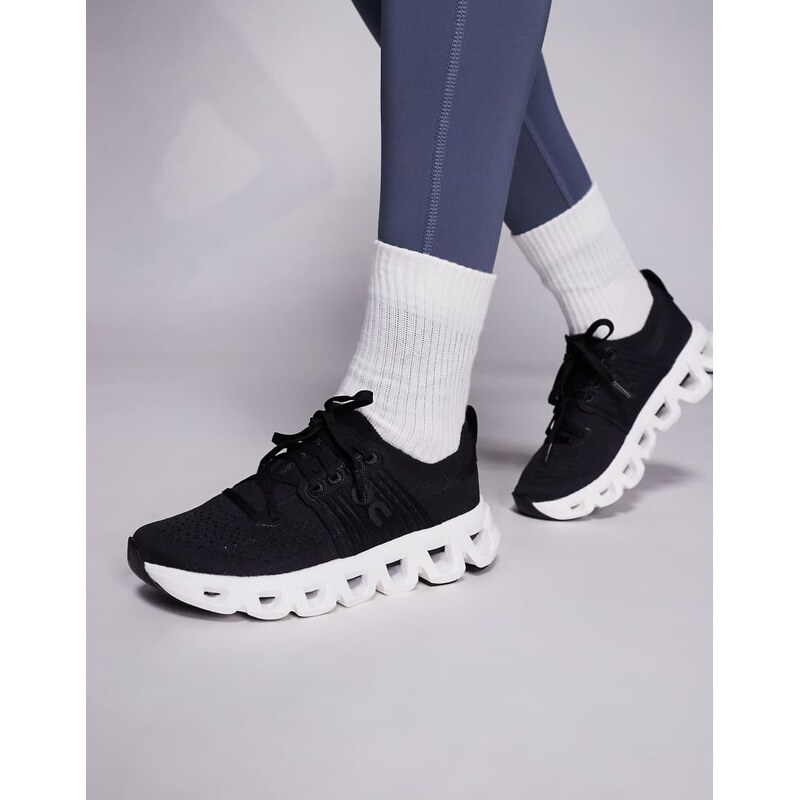 ON Cloudswift 4 running trainers in black and white 106004762