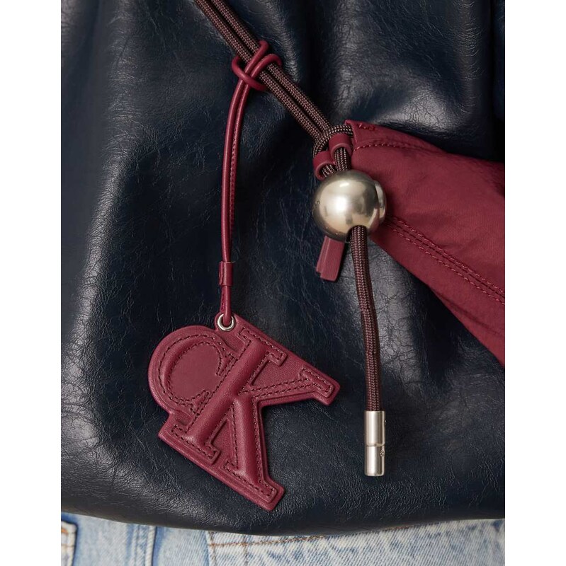 Calvin Klein Jeans embossed monogram leather bag charm in burgundy 112690673
