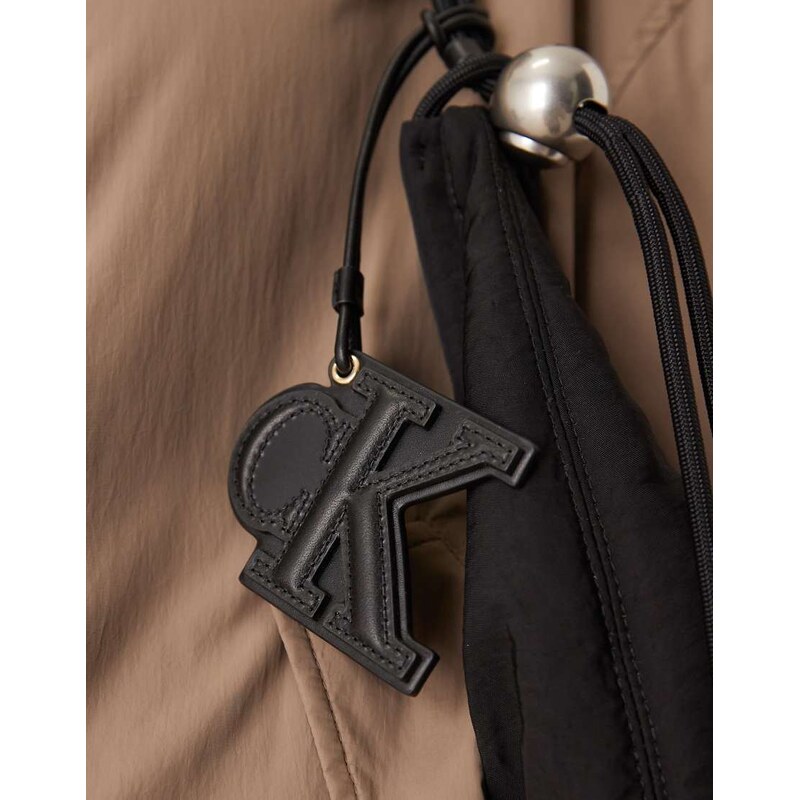 Calvin Klein Jeans embossed monogram leather bag charm in black 112696357