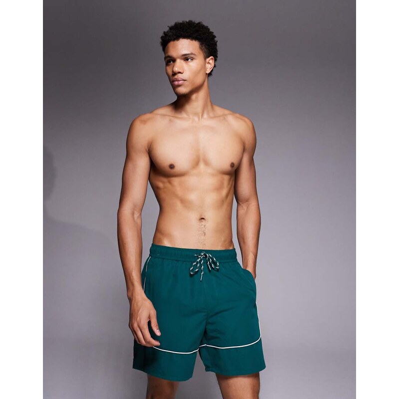ASOS DESIGN swim shorts in mid length in dark green with