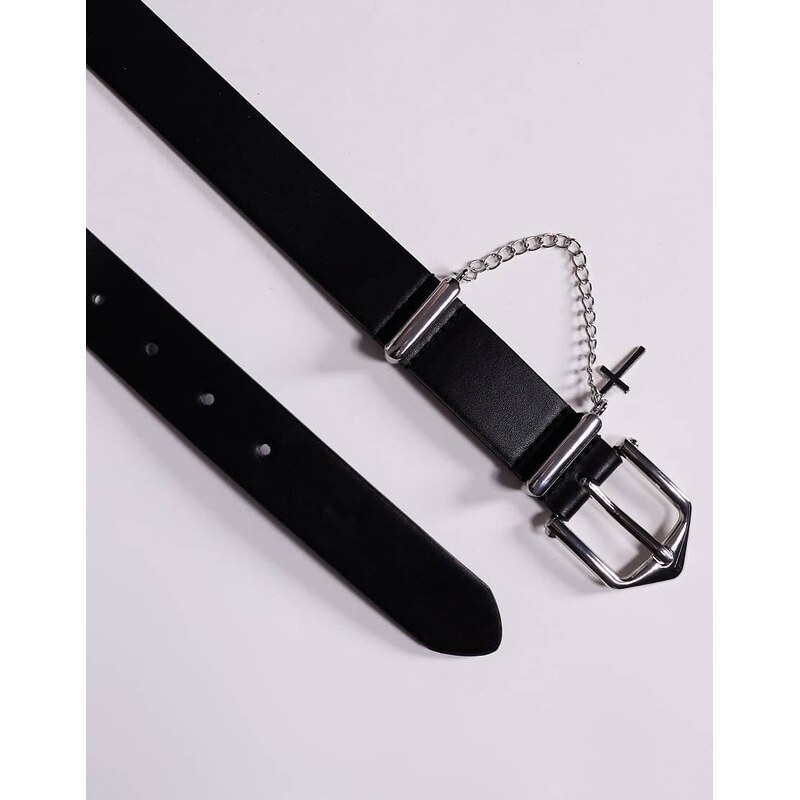 ASOS DESIGN faux leather belt with cross and chain attachment in