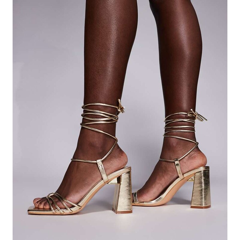 Public Desire Wide Fit Bergamot tie leg block heeled sandals in gold 113070523