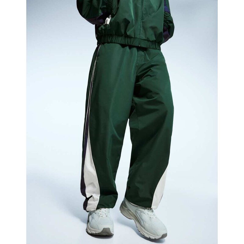 Bershka Super baggy technical sports trousers in green
